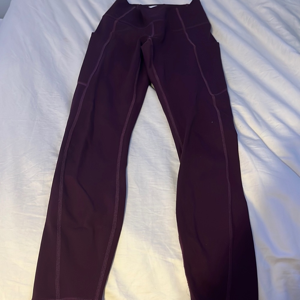 Fabletics leggings in a plum color. Size XXS.
